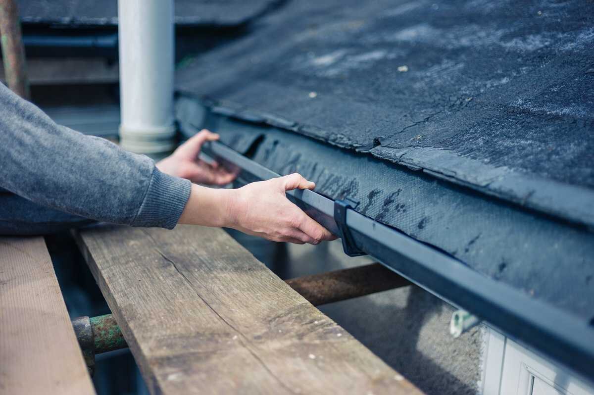 Seamless gutter and downspout installation on a Long Island home